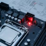 Close-up view of a computer motherboard showing red light signals