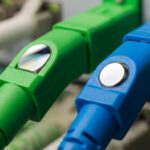 APC (green) and UPC (blue) fiber optic connectors comparison