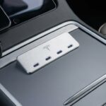 Tesla 4-in-1 USB-C Hub shown in the center console of a Model 3