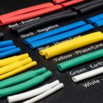 Color-coded heat shrink tubing arranged on a black background