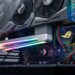 Close-up of an ARGB GPU sag bracket with RGB lighting and color-coded wires