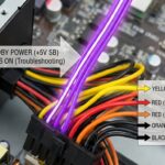Close-up view of a power supply's purple wire with labeled technical diagram