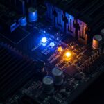 Close-up of a Gigabyte motherboard with illuminated status lights